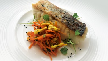 Roast hake and Bombay-style carrots with cashews and raisins