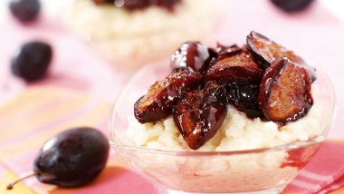 Baked rice pudding with greengages or plums
