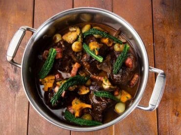 Red wine braised beef cheeks with glazed onions, smoked bacon and wild mushroom